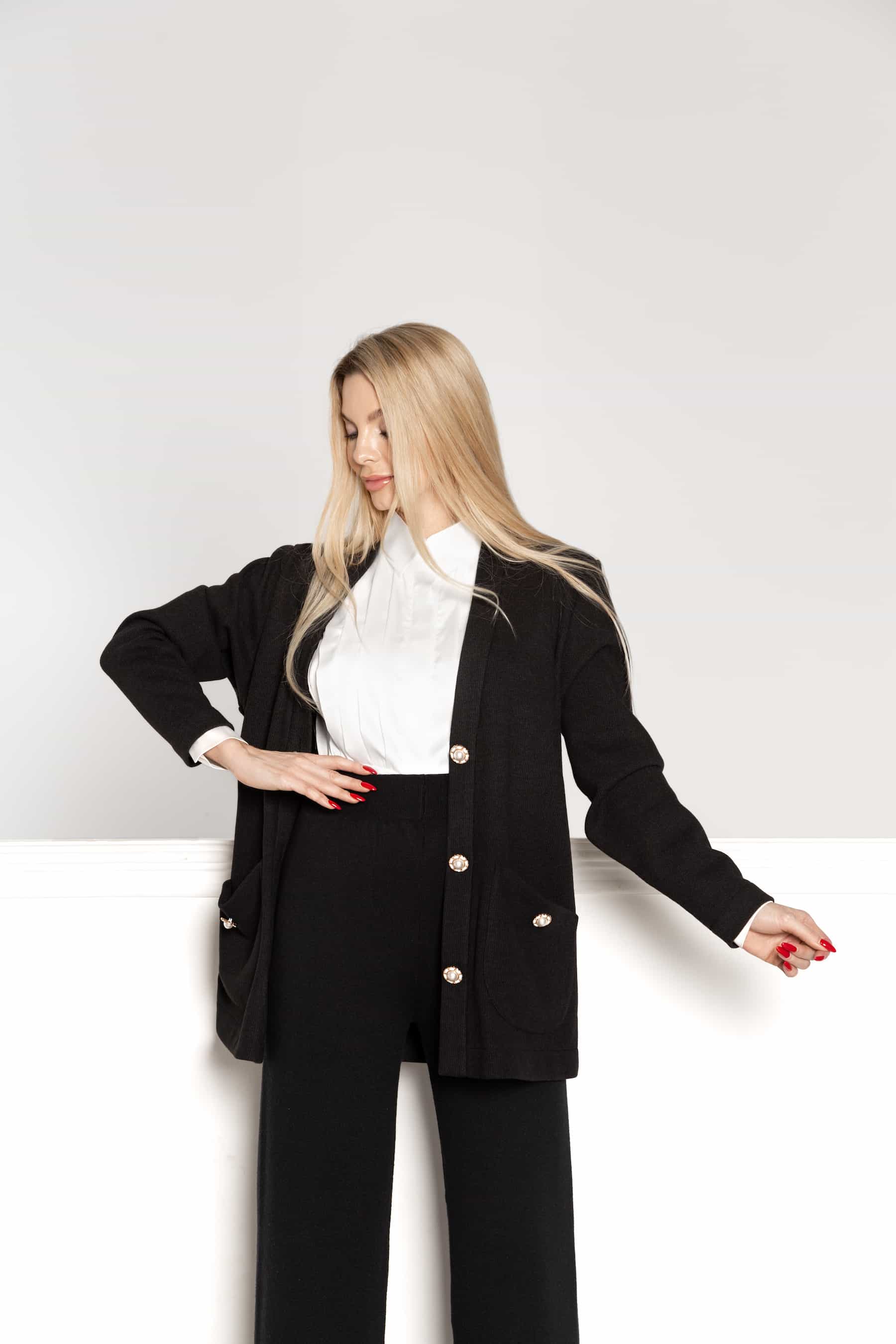 Black woolen cardigan with pockets and large buttons